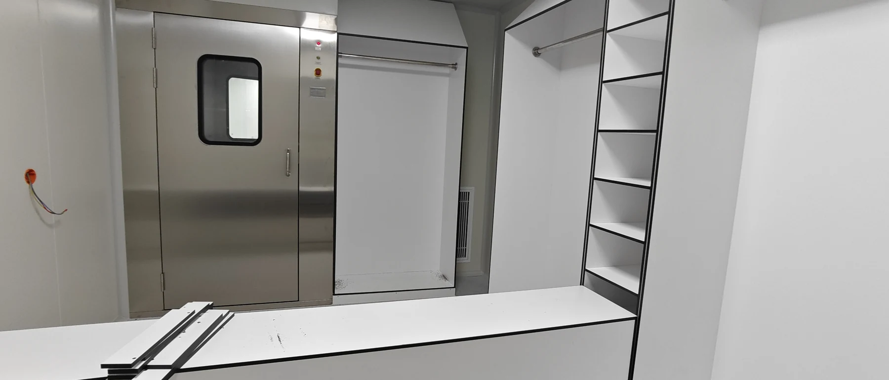 Gowning storage, changing bench and stainless-steel air shower entrance during installation
